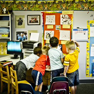 Child playing with toys in classroom