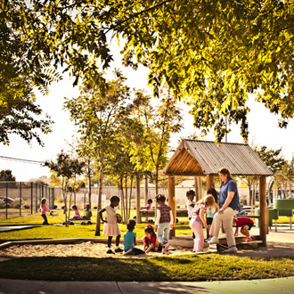 Teacher with children on the playground