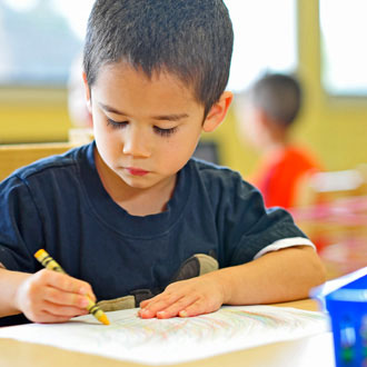 Preschool boy coloring