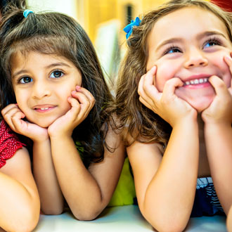 Two girls smiling