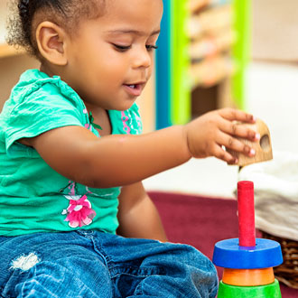 Toddler playing with blocks